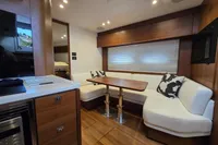 Luxurious interior of 2014 Princess V48 Open yacht with elegant seating and dining area.