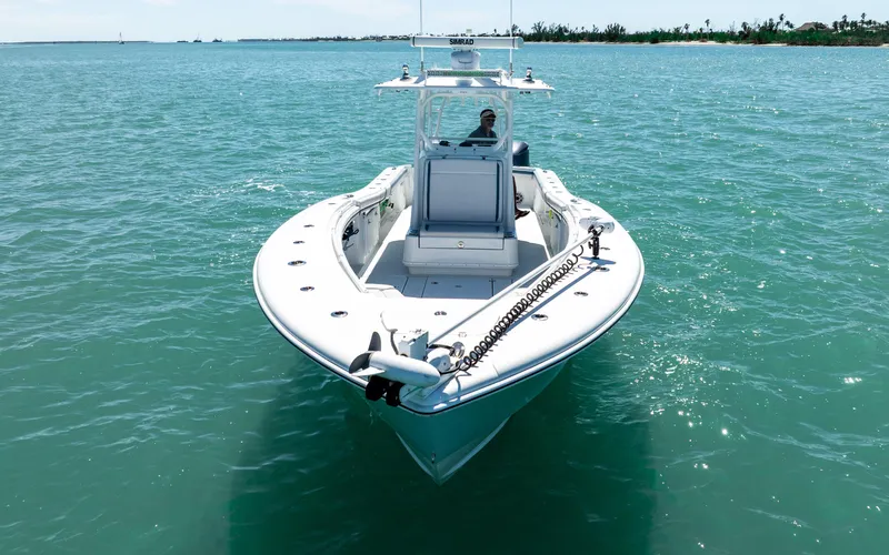  Yacht Photos Pics 2019 Yellowfin 36 boat on clear turquoise water, viewed from the front.