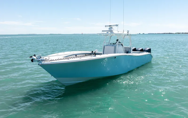  Yacht Photos Pics 2019 Yellowfin 36 boat on calm blue water, clear sky background.