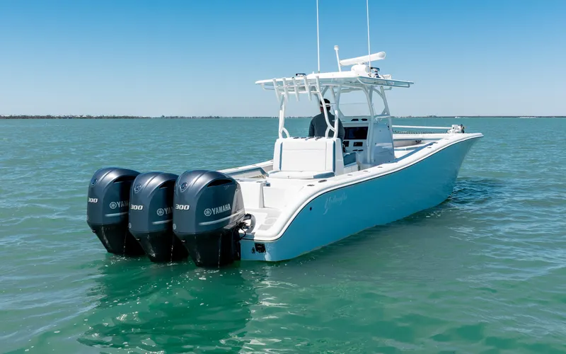  Yacht Photos Pics 2019 Yellowfin 36 boat with triple Yamaha engines on open water.
