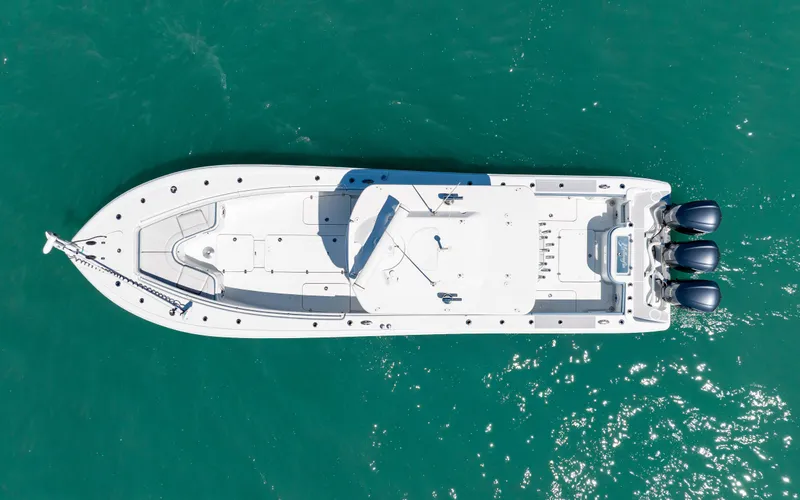  Yacht Photos Pics Aerial view of 2019 Yellowfin 36 boat on turquoise water.