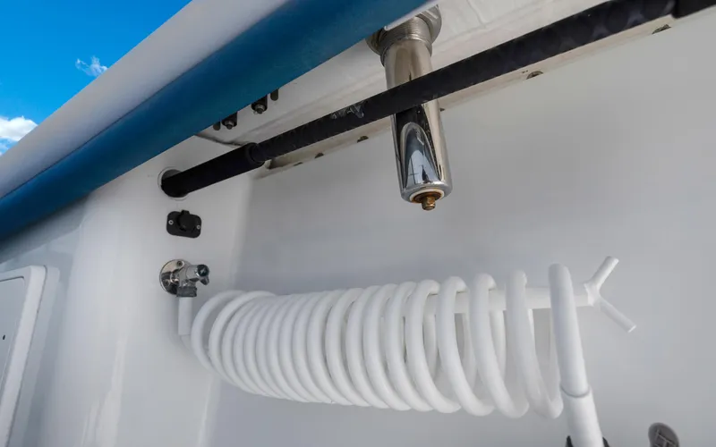  Yacht Photos Pics 2019 Yellowfin 36 boat detail with coiled hose and faucet.