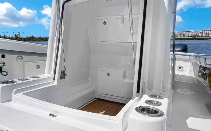  Yacht Photos Pics 2019 Yellowfin 36 boat interior with open storage compartment and cup holders.