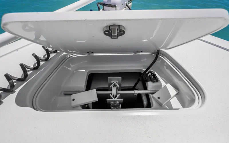 Yacht Photos Pics Open anchor compartment on 2019 Yellowfin 36 boat, showing storage and mechanism.