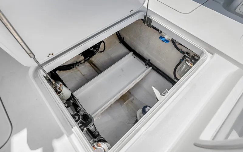  Yacht Photos Pics 2019 Yellowfin 36 boat storage compartment with visible wiring and components.