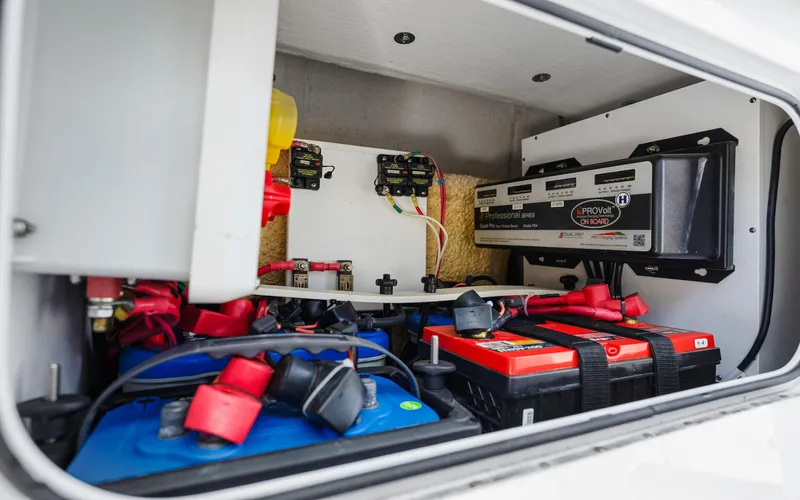  Yacht Photos Pics Electrical system of a 2019 Yellowfin 36 boat, featuring batteries and wiring components.