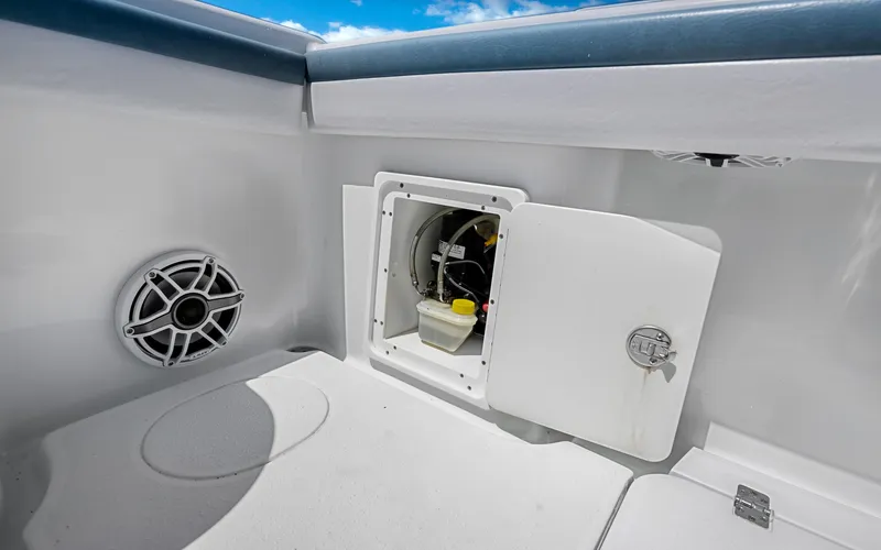  Yacht Photos Pics 2019 Yellowfin 36 boat interior with open storage compartment and speaker.
