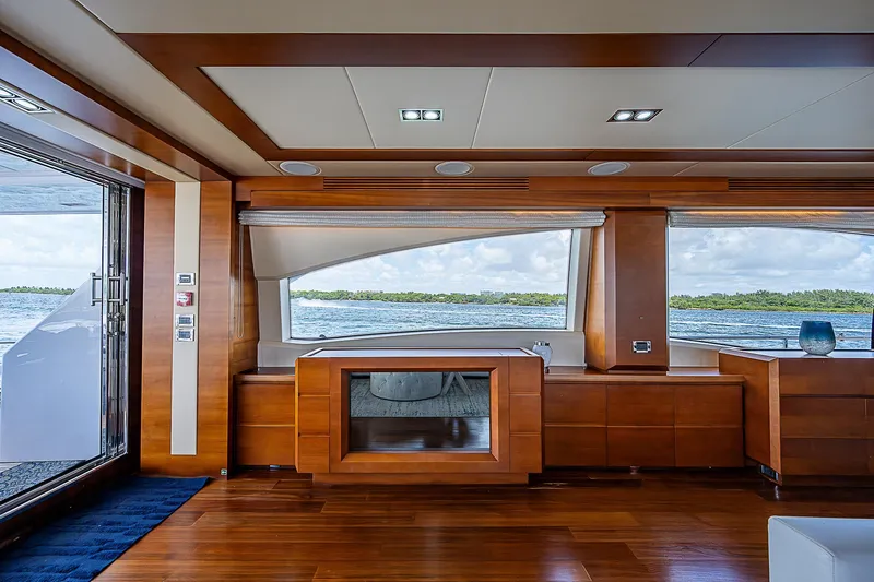 Reset Yacht Photos Pics Luxurious interior of 2011 Azimut 82 yacht with panoramic windows and elegant wood finishes.