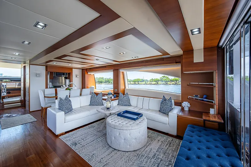 Reset Yacht Photos Pics Luxurious interior of 2011 Azimut 82 yacht with elegant seating and scenic views.