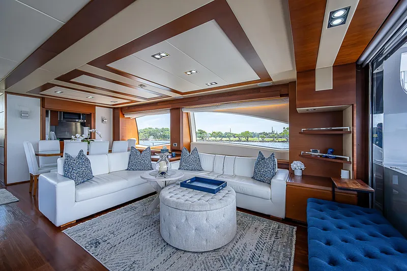 Reset Yacht Photos Pics Luxurious interior of 2011 Azimut 82 yacht with elegant white seating and modern decor.