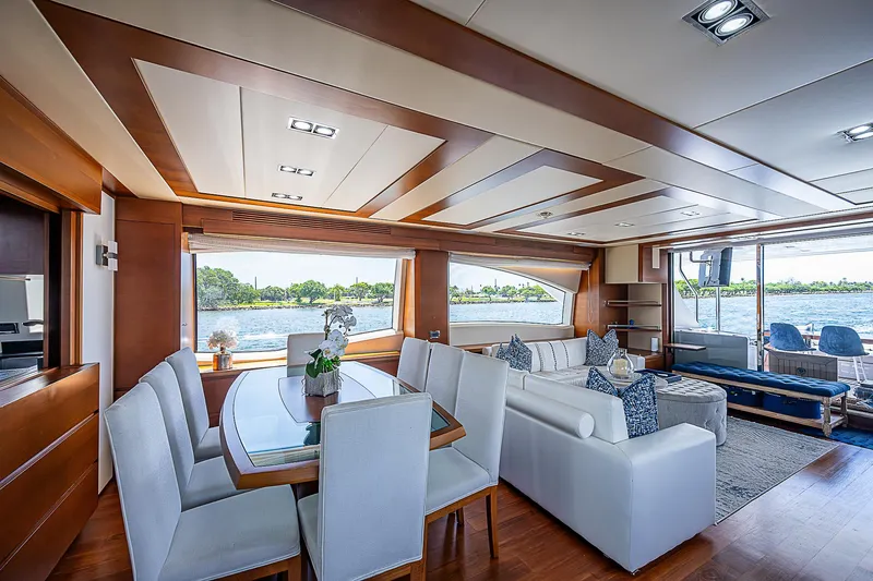 Reset Yacht Photos Pics Luxurious interior of 2011 Azimut 82 yacht with elegant dining and seating area.