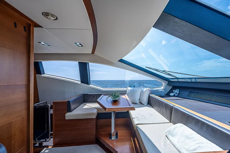 Reset Yacht Photos Pics Luxurious interior of 2011 Azimut 82 yacht with panoramic windows and elegant seating.