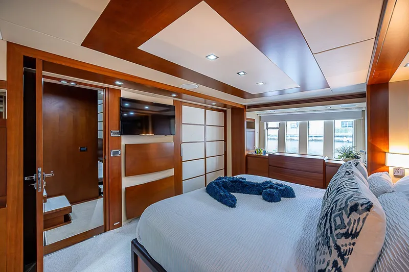 Reset Yacht Photos Pics Luxurious bedroom interior of 2011 Azimut 82 yacht with modern design and elegant furnishings.