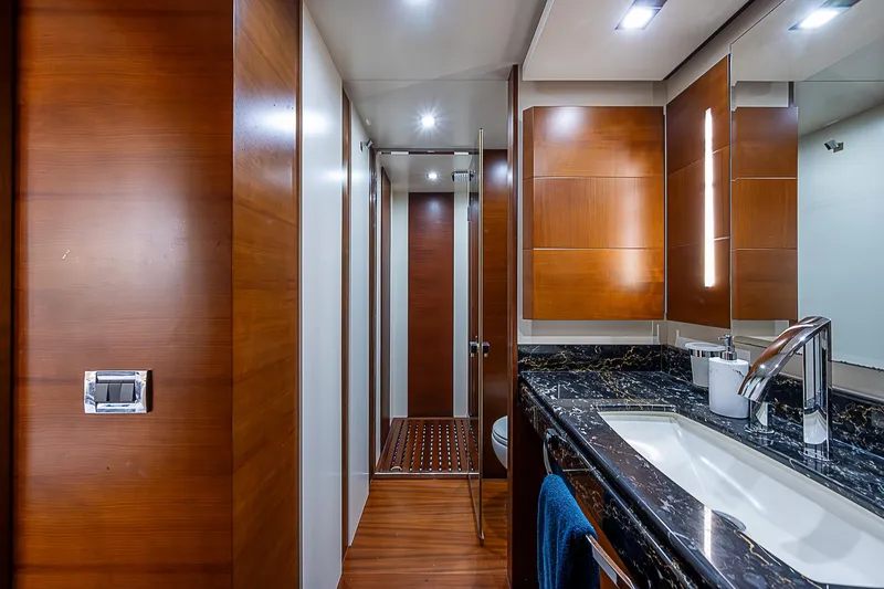 Reset Yacht Photos Pics Luxurious bathroom in 2011 Azimut 82 yacht with wood paneling and modern fixtures.