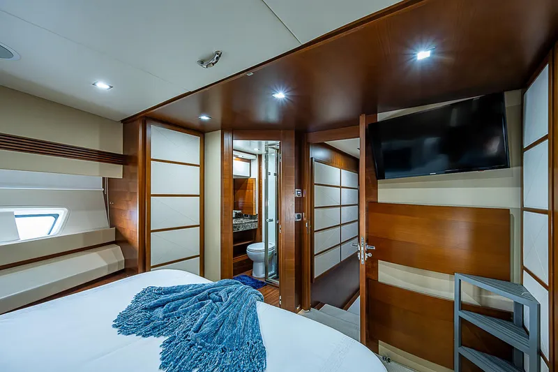 Reset Yacht Photos Pics Luxurious bedroom interior of 2011 Azimut 82 yacht with modern design and amenities.