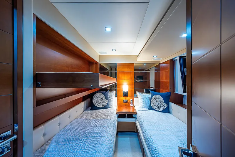 Reset Yacht Photos Pics Luxurious twin cabin interior on 2011 Azimut 82 yacht, featuring elegant wood paneling and modern lighting.