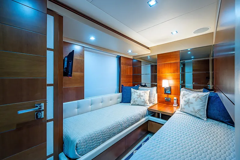 Reset Yacht Photos Pics Luxurious cabin interior of 2011 Azimut 82 yacht with twin beds and modern decor.