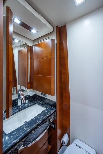 Reset Yacht Photos Pics Luxurious bathroom in 2011 Azimut 82 yacht with wood accents and modern fixtures.