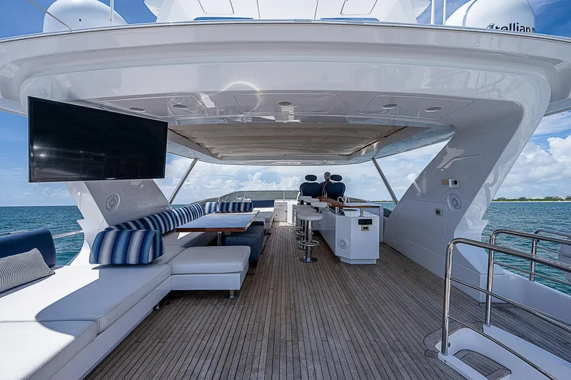 Reset Yacht Photos Pics Luxurious 2011 Azimut 82 yacht deck with seating, TV, and ocean view.