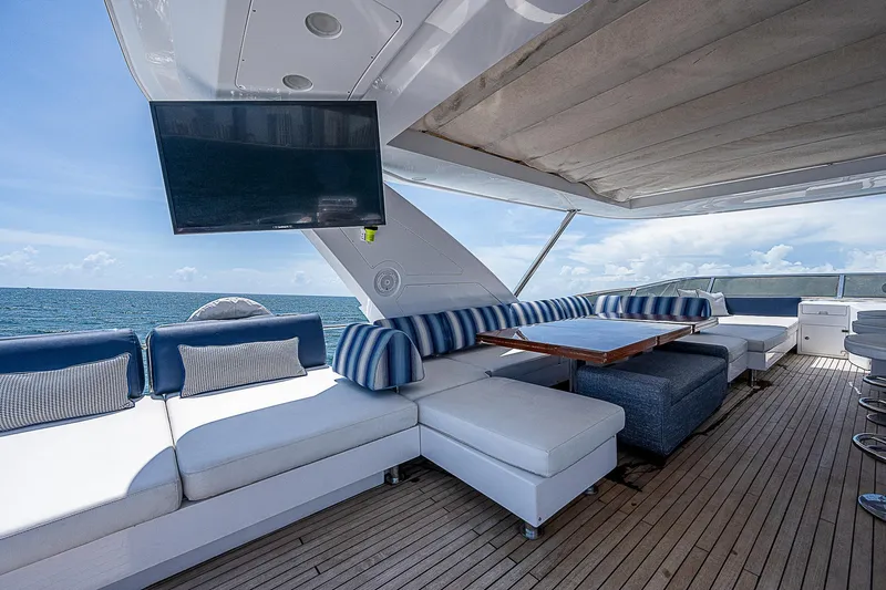 Reset Yacht Photos Pics Luxurious 2011 Azimut 82 yacht deck with seating, TV, and ocean view.