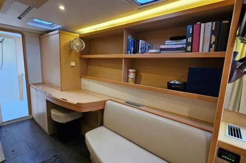 Never Say Never Yacht Photos Pics Interior of 2017 Lagoon 42 yacht with wooden shelves and seating area.