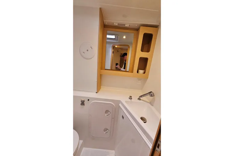 Never Say Never Yacht Photos Pics Bathroom interior of 2017 Lagoon 42 catamaran with sink and mirror cabinet.