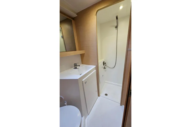 Never Say Never Yacht Photos Pics 2017 Lagoon 42 yacht bathroom with shower, sink, and modern fixtures.