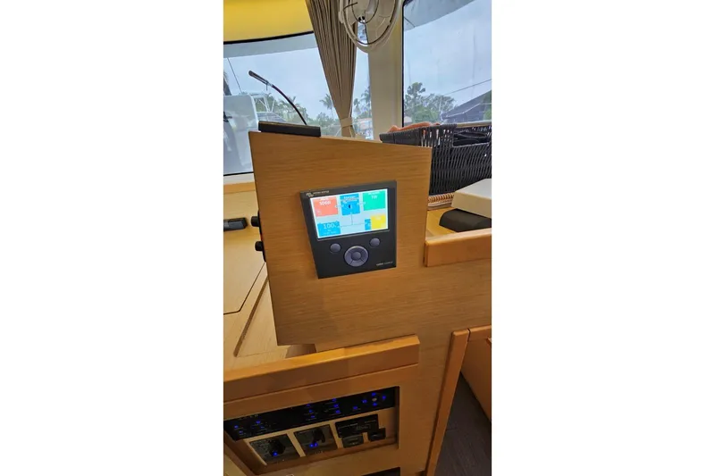 Never Say Never Yacht Photos Pics Control panel inside 2017 Lagoon 42 catamaran, featuring modern navigation and monitoring systems.