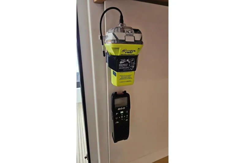 Never Say Never Yacht Photos Pics Emergency beacon and device on 2017 Lagoon 42 yacht interior wall.