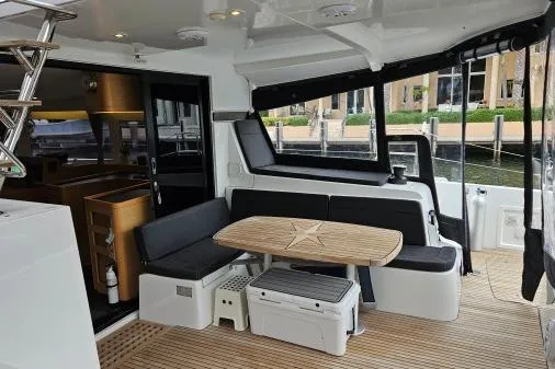 Never Say Never Yacht Photos Pics 2017 Lagoon 42 yacht interior with seating, table, and modern design.
