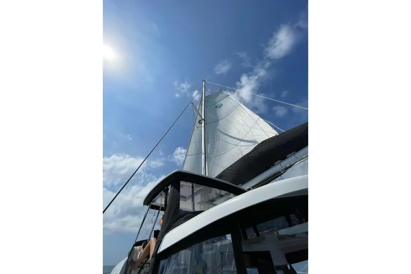 Never Say Never Yacht Photos Pics Sailing on a 2017 Lagoon 42 catamaran under clear blue skies.