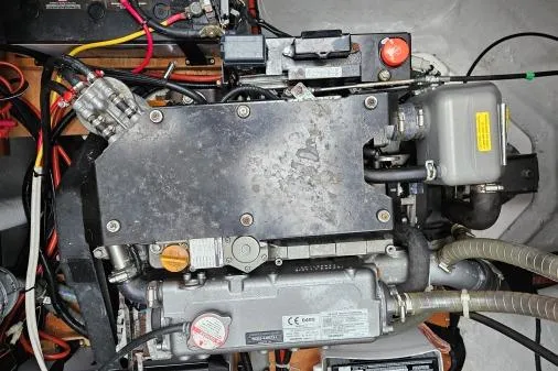 Never Say Never Yacht Photos Pics Engine compartment of a 2017 Lagoon 42 catamaran, showcasing mechanical components and wiring.