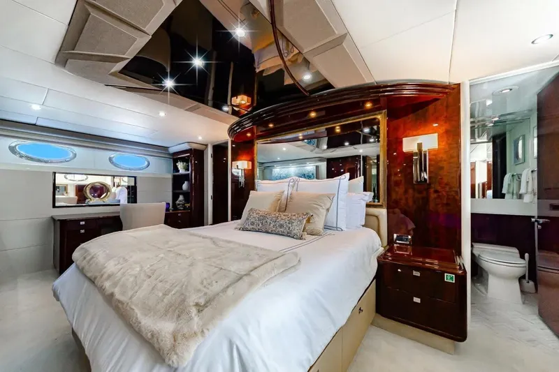 Serendipity Yacht Photos Pics Luxurious bedroom interior of 2001 Lazzara 94 Motor Yacht with elegant furnishings.
