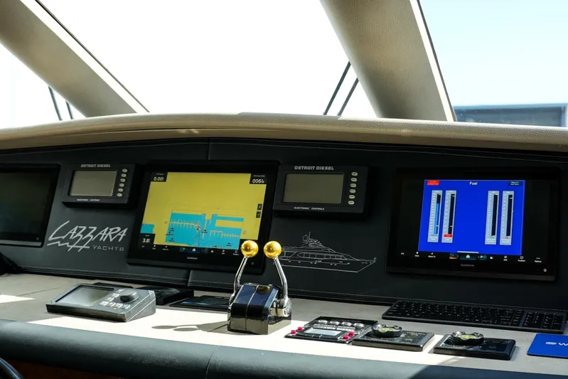 Serendipity Yacht Photos Pics Control panel of 2001 Lazzara 94 Motor Yacht with navigation and fuel displays.