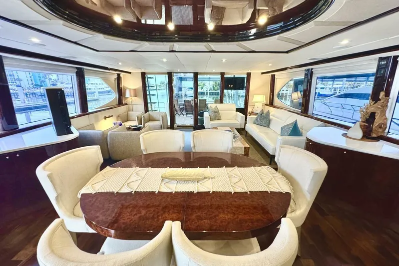 Serendipity Yacht Photos Pics Luxurious interior of 2001 Lazzara 94 Motor Yacht with elegant dining and seating area.
