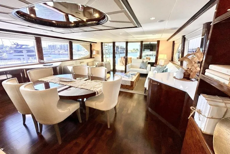 Serendipity Yacht Photos Pics Luxurious interior of 2001 Lazzara 94 Motor Yacht with elegant dining and seating area.