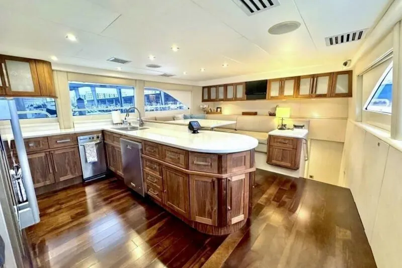 Serendipity Yacht Photos Pics Luxurious interior of 2001 Lazzara 94 Motor Yacht with elegant wood cabinetry and modern amenities.