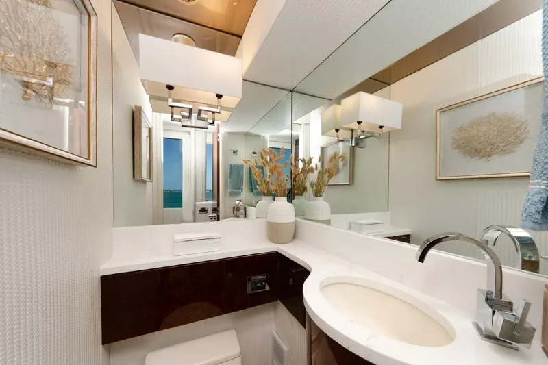 Serendipity Yacht Photos Pics Luxurious bathroom on 2001 Lazzara 94 Motor Yacht with elegant decor and modern fixtures.