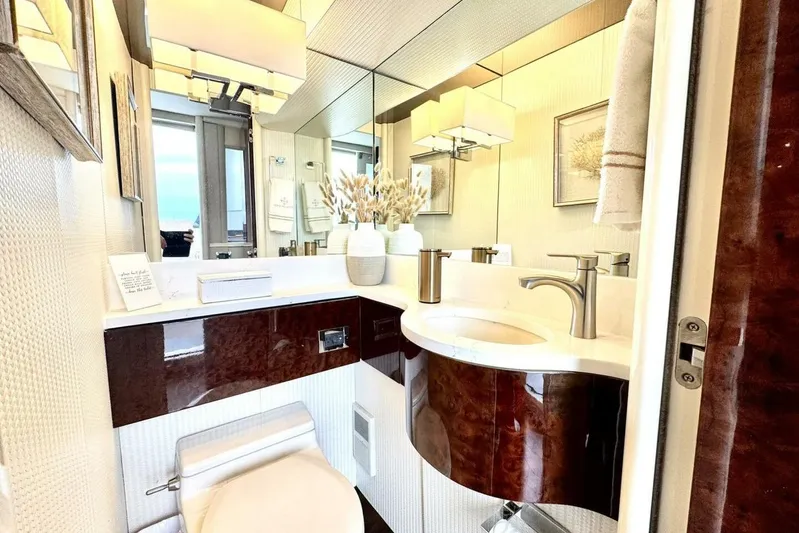 Serendipity Yacht Photos Pics Luxurious bathroom in 2001 Lazzara 94 Motor Yacht with elegant fixtures and decor.