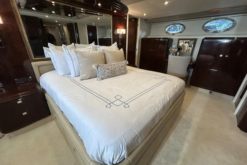 Serendipity Yacht Photos Pics Luxurious bedroom interior of 2001 Lazzara 94 Motor Yacht with elegant bedding.