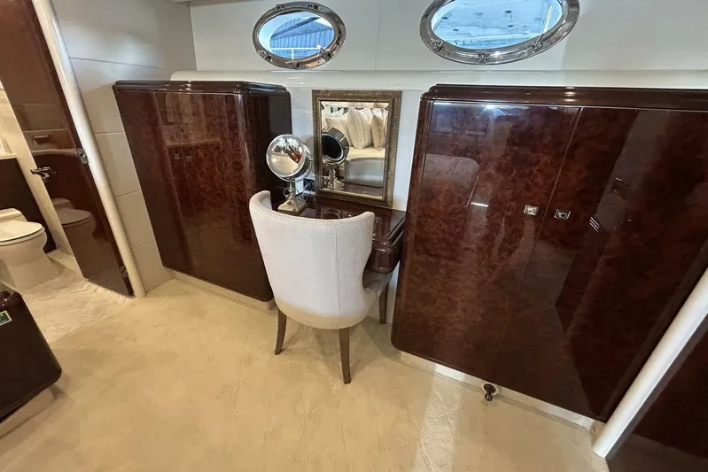 Serendipity Yacht Photos Pics Luxurious vanity area on 2001 Lazzara 94 Motor Yacht with elegant wood finish.