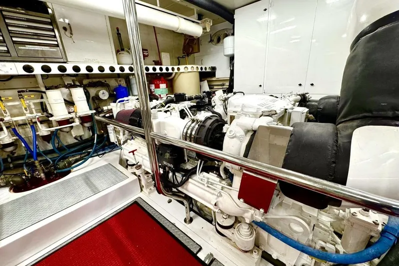 Serendipity Yacht Photos Pics Engine room of 2001 Lazzara 94 Motor Yacht, featuring complex machinery and piping.