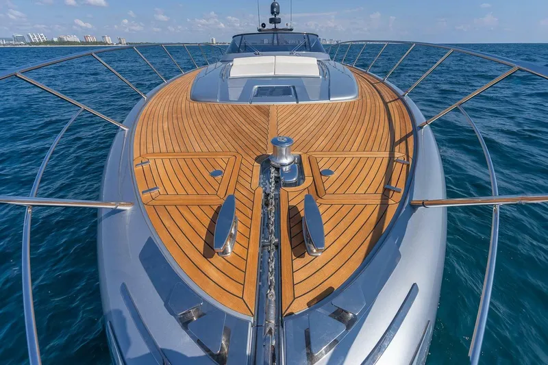 Mild Things Yacht Photos Pics 2014 Riva 63 Virtus yacht with sleek wooden deck on open sea.
