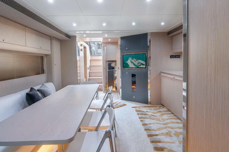 Mild Things Yacht Photos Pics Luxurious interior of 2014 Riva 63 Virtus yacht with modern dining area and stylish decor.