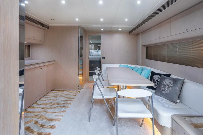 Mild Things Yacht Photos Pics Luxurious interior of 2014 Riva 63 Virtus yacht with modern dining area and stylish decor.