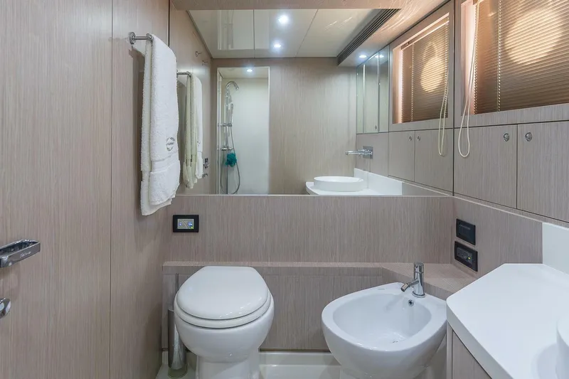 Mild Things Yacht Photos Pics Luxurious bathroom interior of 2014 Riva 63 Virtus yacht with modern fixtures.