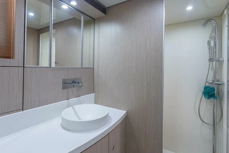 Mild Things Yacht Photos Pics Luxurious bathroom interior of 2014 Riva 63 Virtus yacht with modern fixtures.