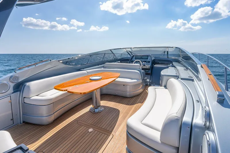 Mild Things Yacht Photos Pics Luxurious 2014 Riva 63 Virtus yacht interior with elegant seating and ocean view.