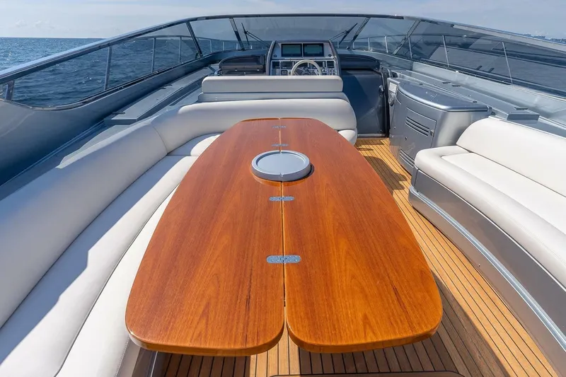 Mild Things Yacht Photos Pics Luxurious 2014 Riva 63 Virtus yacht with elegant wooden deck and seating area.