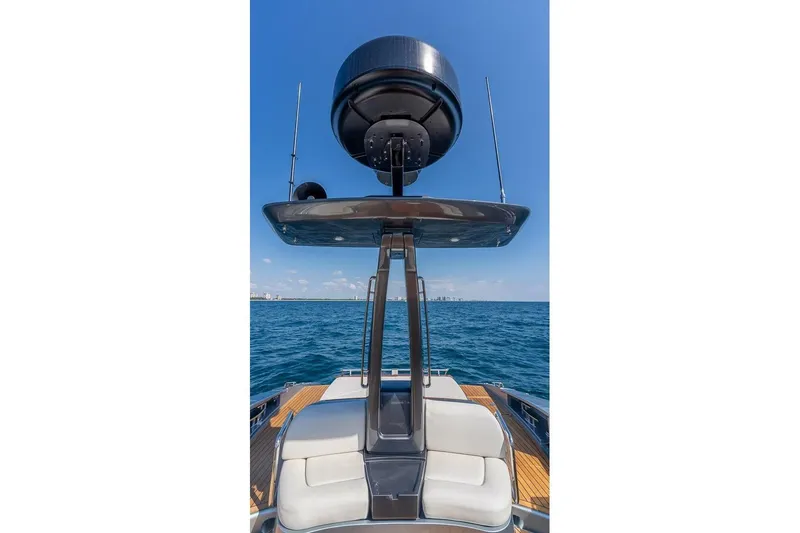 Mild Things Yacht Photos Pics 2014 Riva 63 Virtus yacht with radar, ocean view, and clear blue sky.